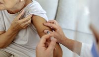 Elderly woman getting a vaccination. 