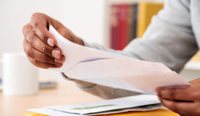 Man opening letter
