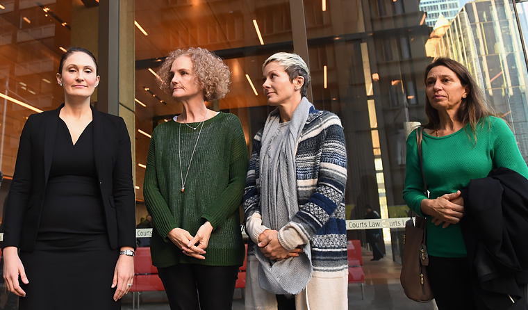 L–R: Lawyer Rebecca Jancauskas standing with Gai Thompson, Joanne Maninon and Carina Anderson, who are part of a class action against Johnson & Johnson. (Image: Paul Miller)  