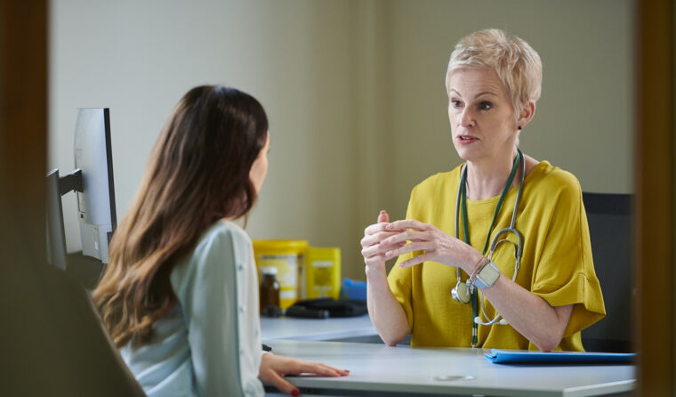 GP having serious discussion with patient
