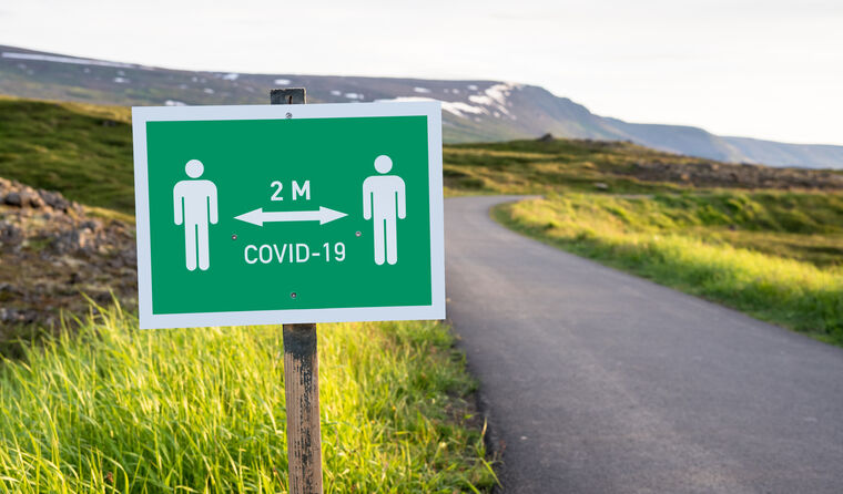 Icelandic countryside with social distancing sign.