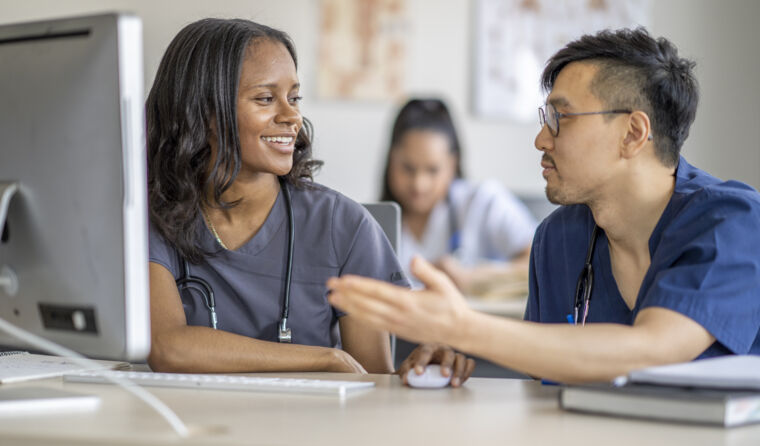 Two medical students talking.