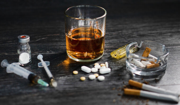 Alcohol and other drugs spread on table