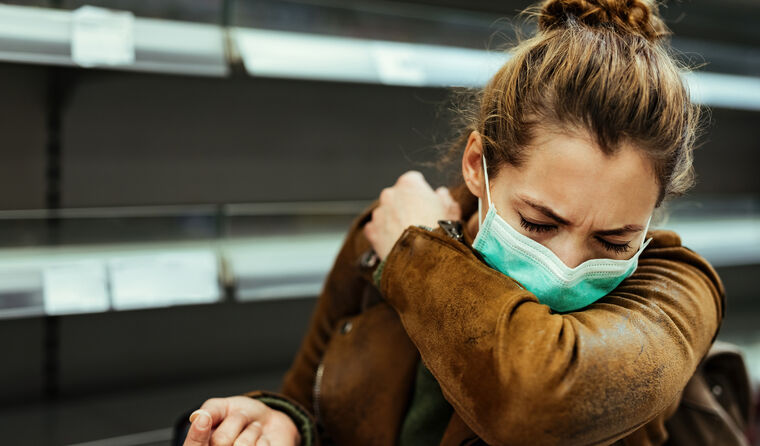 A woman wearing a mask.