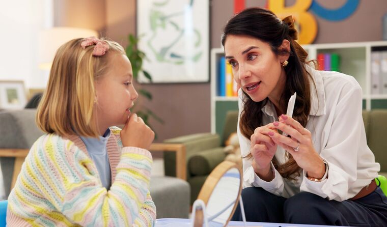 Child having therapy with speech pathologist