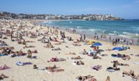 People sunbaking on Bondi Beach.