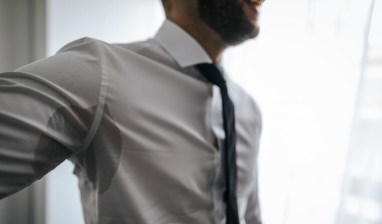 Man sweating through his shirt.