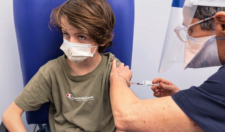 Young boy receiving Pfizer vaccine