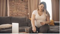 Pregnant woman checking blood glucose levels.