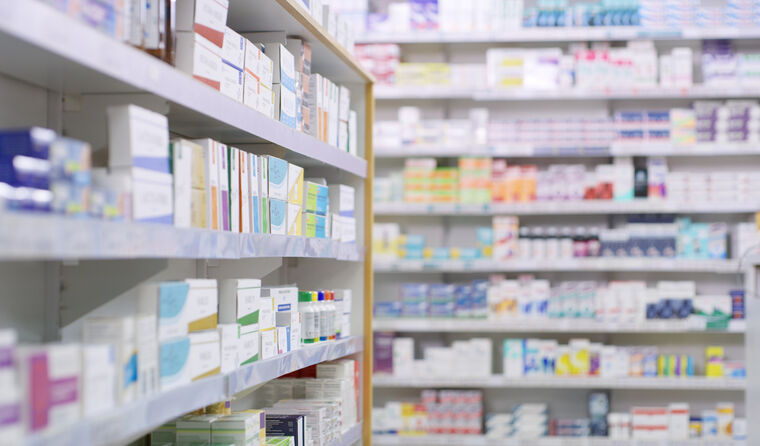 Pharmacy shelves stocked with medication