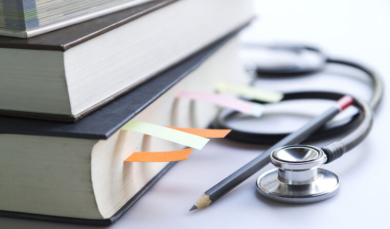 Textbook with stethoscope