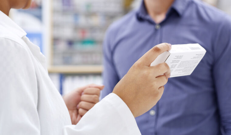 Pharmacist with prescribed medication