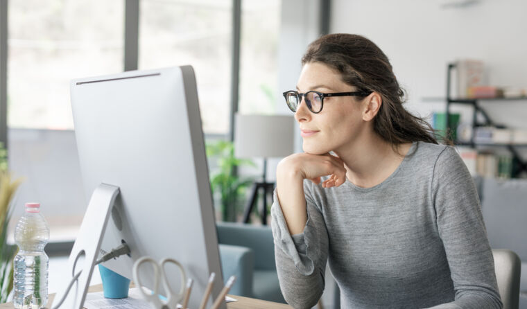 Doctor looking at computer.