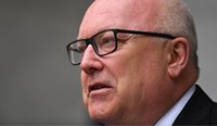 High Commissioner to the UK George Brandis has told a British radio program that all asylum seeker children will be removed from Nauru by the end of the year. (Image: Lukas Coch)