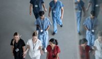 Group of medical practitioners walking and talking