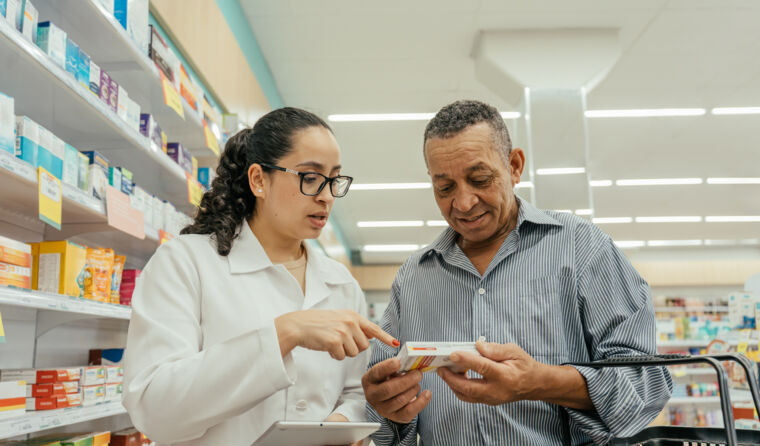 Patient talking to pharmacist about medication