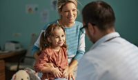Mother and daughter visiting the GP.
