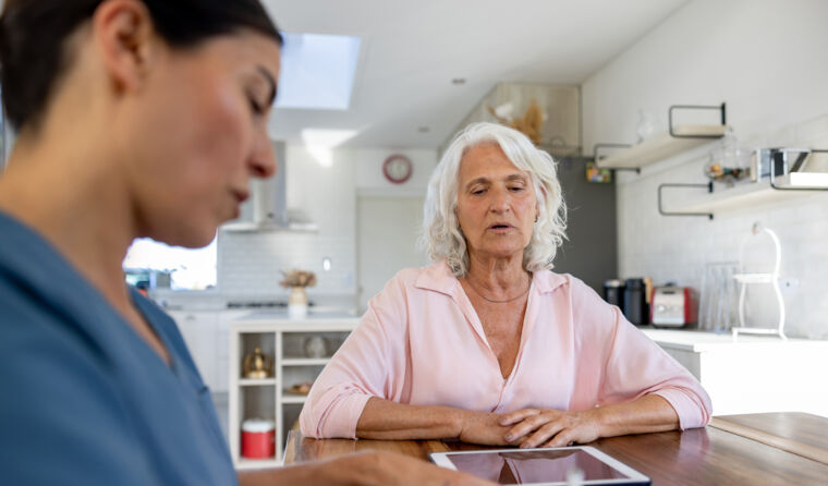 Older person at home with GP