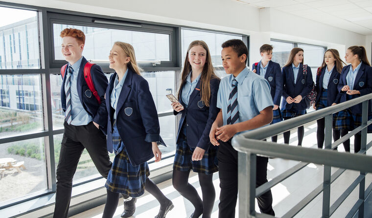 Group of high school students walking and talking