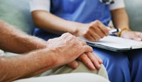 Person with PTSD with health professional