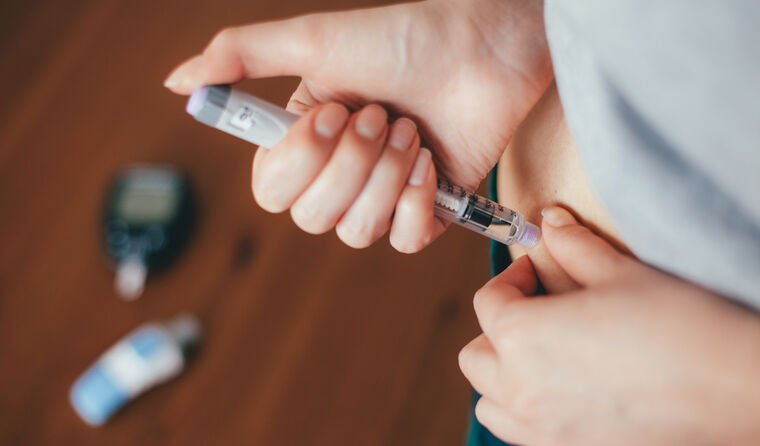 Person injecting insulin