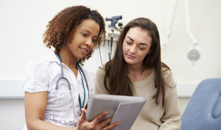 Nurse consulting with young female