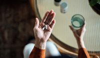 Aerial view of woman taking medication