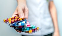 Pharmacist providing pills