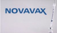 A needle in a vial of Novavax.