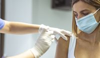 A woman being vaccinated. 