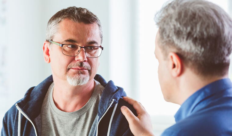 Patient in serious discussion with GP