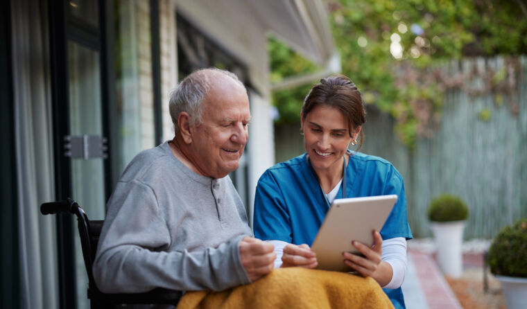 Two people using a tablet