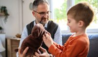 Doctor consulting with a child.