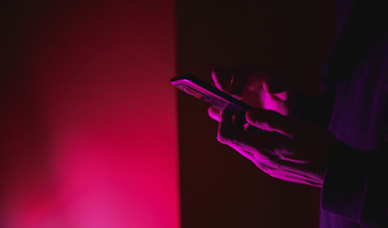 Person typing on phone.