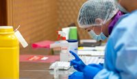 Medical workers prepare the Pfizer/BioNTech coronavirus vaccine at the Hyatt Perth quarantine hotel. (Image: AAP)