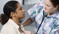 GP checking patient