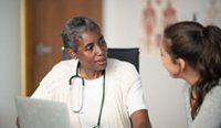 GP having serious discussion with patient