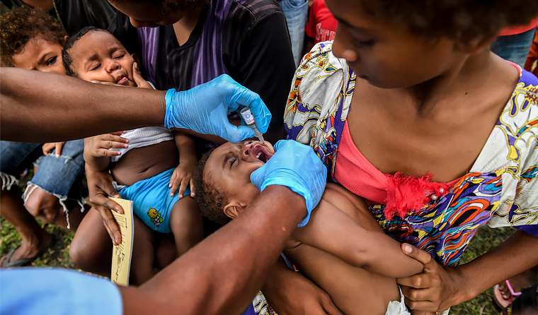 The PNG Government will roll out a rapid response vaccination campaign in Port Moresby from 24 September, moving nationwide in October. (Image: AAP)