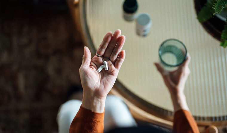 Aerial view of woman taking medication