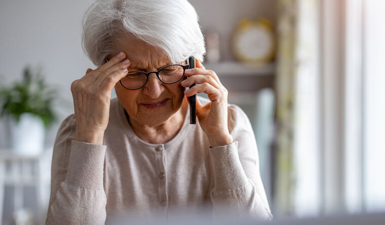 Sick older woman on phone