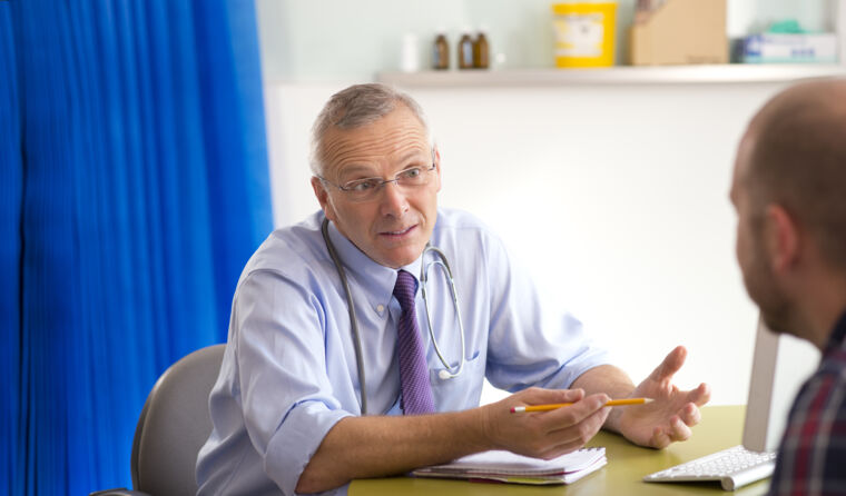 Man in consultation with GP