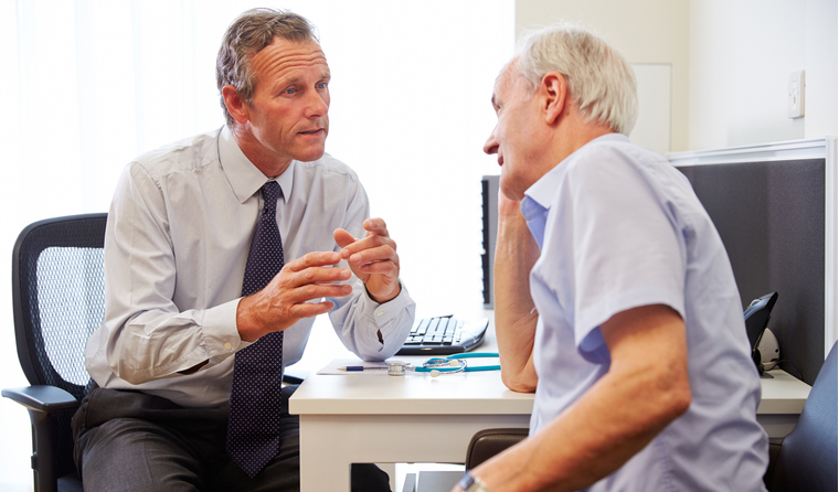 A GP speaking to a patient.
