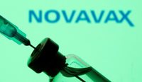 Doctor drawing Novavax vaccine from vial.