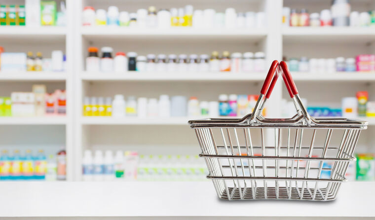Pharmacy shelves with shopping basket