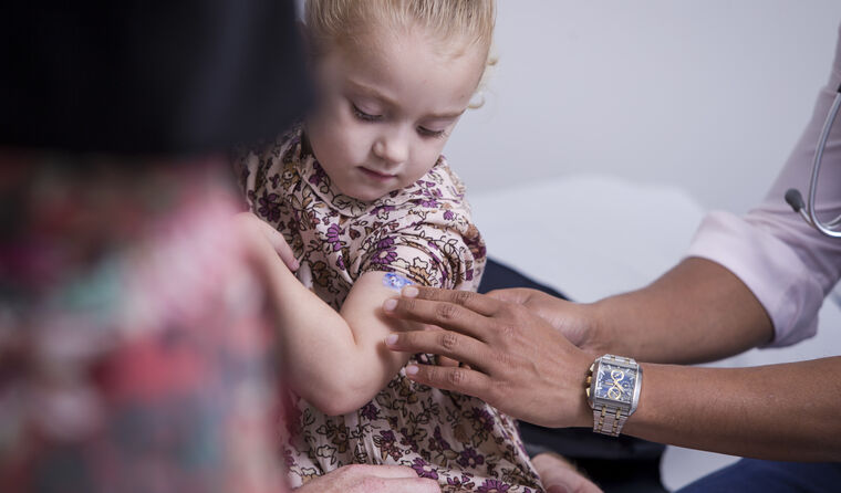 Little girl being vaccinated