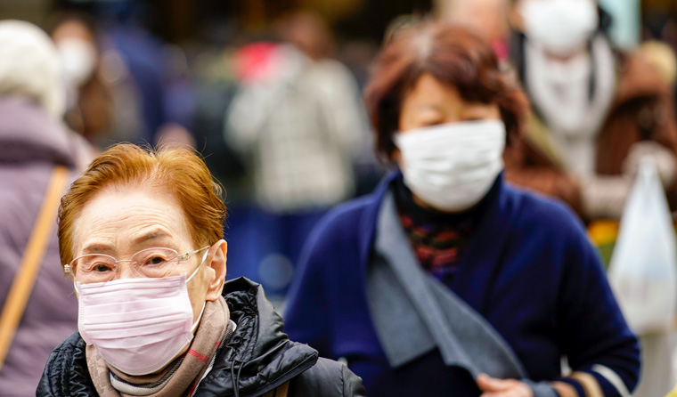 People in Tokyo wearing protective masks