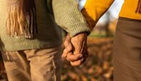 Older couple outside walking