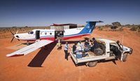 RFDS plane next to patient on back of ute.