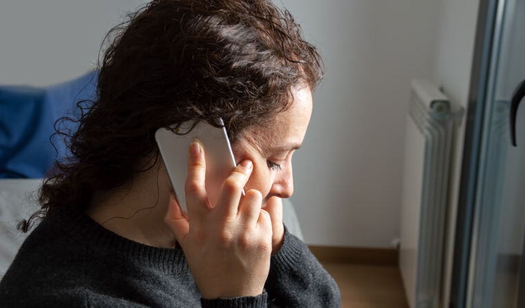 Distressed woman on phone