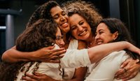Group of happy women hugging